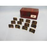 Set of twelve Japanese gilt metal and lacquer menu place holders in a Japanese lacquer box