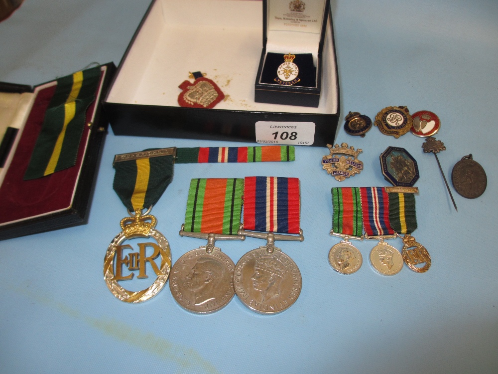 Pair of World War II medals with miniatures