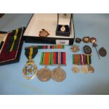 Pair of World War II medals with miniatures