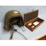 Tank commander's helmet and a modern cased gun cleaning kit