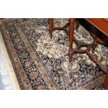 Indo Persian carpet with medallion and all-over floral design on an ivory ground