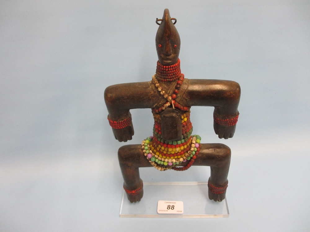 Early 20th Century West African Namchi fertility doll mounted on a Perspex stand,