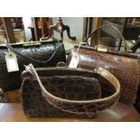 Two vintage brown tan crocodile skin handbags together with another similar smaller handbag