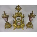 French style gilt metal and porcelain mounted three piece clock garniture with a two train movement