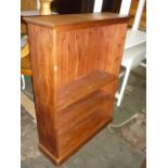 Reproduction stained pine open bookcase with adjustable shelves on a plinth base