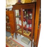 Edwardian mahogany and satinwood crossbanded two door display cabinet with leaded glass doors