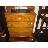 Small mid 20th Century walnut bow front chest of four drawers with brass drop handles and cabriole