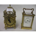 Small brass cased single train carriage clock with enamel dial and Roman numerals,