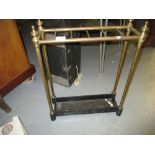 Early 20th Century brass six division stick stand with iron drip tray