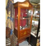 Edwardian mahogany and marquetry inlaid display cabinet with an arched moulded cornice above a