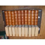 Complete set in twenty volumes of Charles Dickens, having oatmeal boards with leather spines,