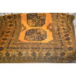 Afghan gold ground rug with single row of four gols within multiple borders,