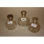 Group of three various silver mounted scent bottles