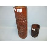 Carved bamboo vase together with a similar smaller brush pot