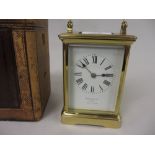 Good quality gilt brass cased carriage clock, the enamel dial with Roman numerals,