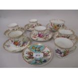 Group of six various Dresden porcelain coffee cups and saucers decorated with floral sprigs,