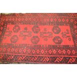 Small Afghan rug on a wine ground,