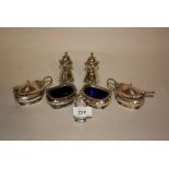 Birmingham silver six piece condiment set together with a similar pepper