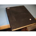 Large black album containing an extensive collection of World stamps