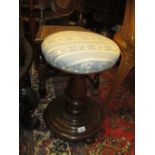 Victorian walnut adjustable circular piano stool on baluster turned column with platform base and