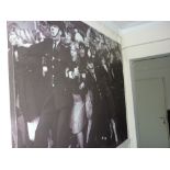 Large modern photographic print on canvas, Police holding back Beatles fans, 1965, label verso,