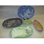 Two blue and white transfer printed meat dishes, an asparagus dish,