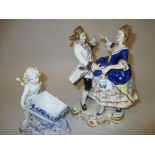 Continental porcelain group of two dancers and a Continental porcelain figure of a cherub with a