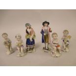 Pair of small Continental porcelain figures of a lady and gentleman,