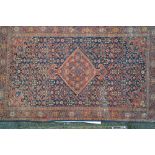 Antique Bidjar rug with lobed medallion and all-over Herati design on a midnight blue ground with