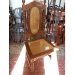 Set of six carved hardwood dining chairs in antique style with cane inset backs and seats on barley