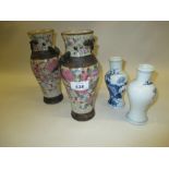 Pair of late 19th Century Canton Famille rose crackle glazed baluster form vases together with a