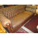 Brown buttoned leather upholstered three seater sofa