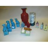 Two pairs of dog of foe figures, a red cinnabar vase and snuff bottle, another snuff bottle,