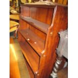 20th Century yew wood double sided waterfall bookcase / room divider having reeded decoration on