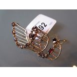 Mid 20th Century 9ct gold garnet set brooch of stylised form