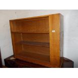 20th Century oak two sided bookcase with single door cabinet to one end
