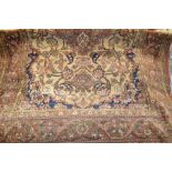 Tabriz rug with centre medallion and all-over floral design on a beige ground with multiple borders,