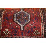 Afghan rug with plain centre and multiple borders,