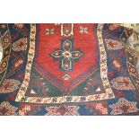 Turkish rug with triple medallion on a wine ground,