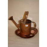 Copper swing handled watering can together with three copper plates