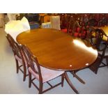 Reproduction mahogany dining room suite comprising: set of eight chairs and a D-end dining table