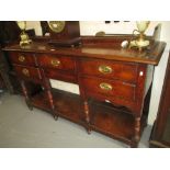 George III oak dresser base, the moulded top above five drawers with oval brass handles,