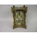 Late 19th or early 20th Century French gilt brass four glass library clock,