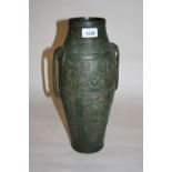 Chinese patinated bronze two handled vase with relief decoration,