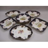 Royal Doulton ten piece dessert service painted with exotic birds within cobalt blue and gilt