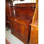 Early 19th Century mahogany chiffonier with shelf back above single drawer and two arched panel