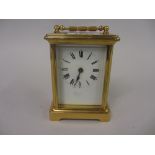 Small brass cased carriage clock, the enamel dial with Roman numerals, signed Walte,