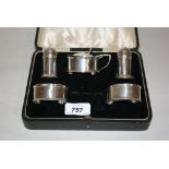 Silver five piece cruet set in fitted box (lacking spoons)