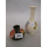 Moorcroft squat form floral decorated vase with green ground together with a larger Moorcroft