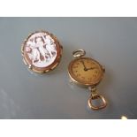 Ladies 14ct gold cased watch (lacking strap) together with a silver gilt cameo brooch